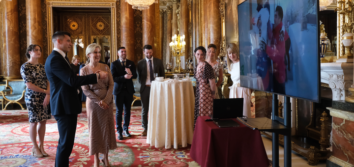 Teams celebrate at Buckingham Palace